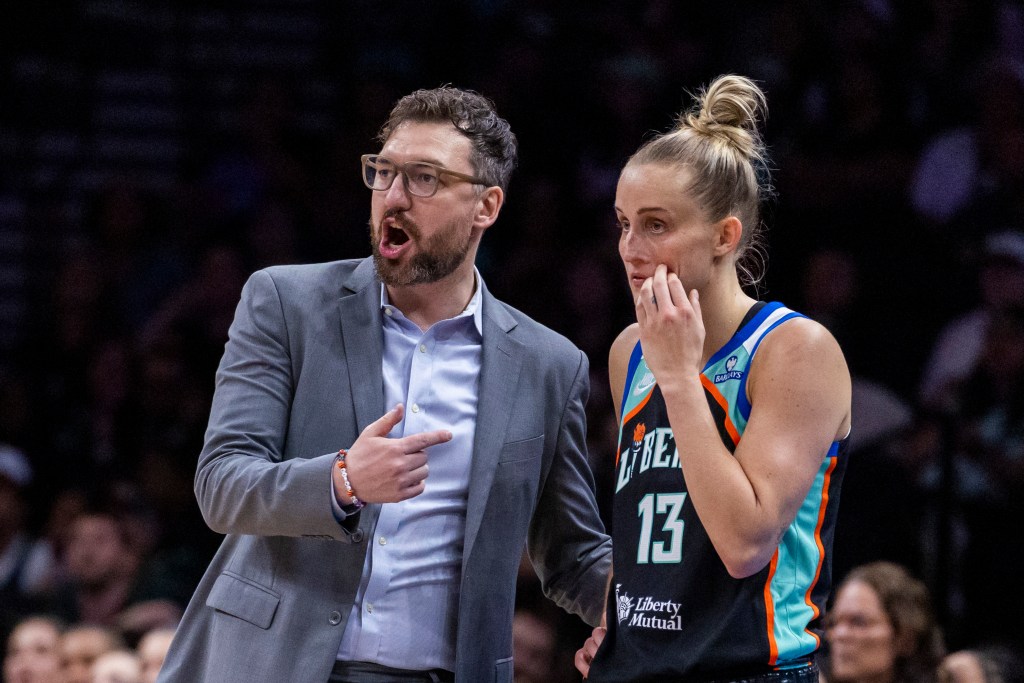 New York Liberty head coach Chris DeMarco talks to New York Liberty forward Leonie Fiebich (13).