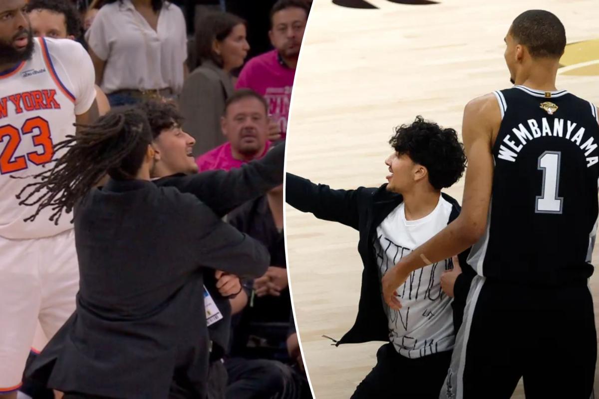 Selfie-taking fan storms court in surreal NBA Finals Game 1 scene