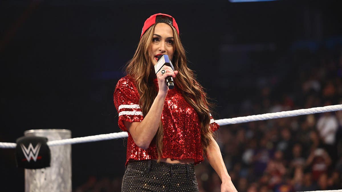 Nikki Bella speaking to crowd at Mortgage Matchup Center in Phoenix