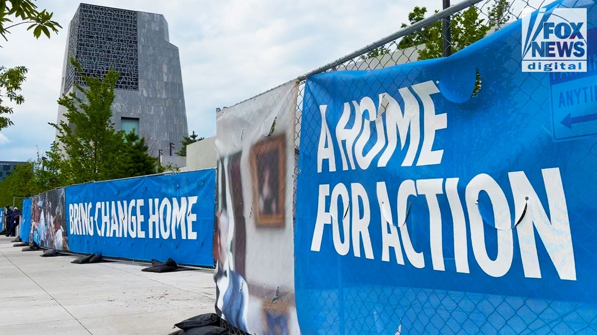 Signs reading "Home For Action" and "Bring Change Home" are displayed outside the Obama Presidential Center in Chicago on June 19, 2026. Critics point to the messaging as evidence the Center functions as more than a traditional presidential library.