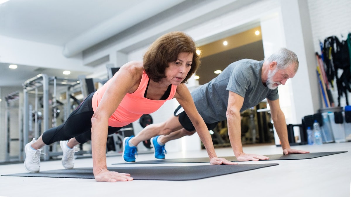 Older adults doing push-ups