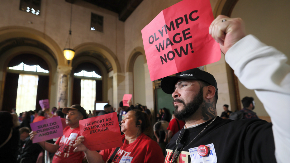 Tourism workers rallied inside and outside City Hall in support of the measure that would increase minimum wage to $30.
