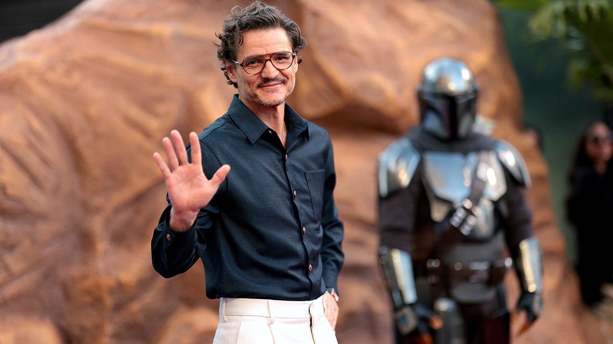 Pedro Pascal standing on the red carpet at The Mandalorian and Grogu Los Angeles premiere