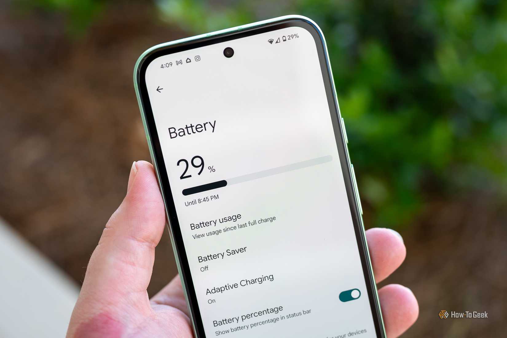 Person holding the Google Pixel 8a showing the Battery menu.