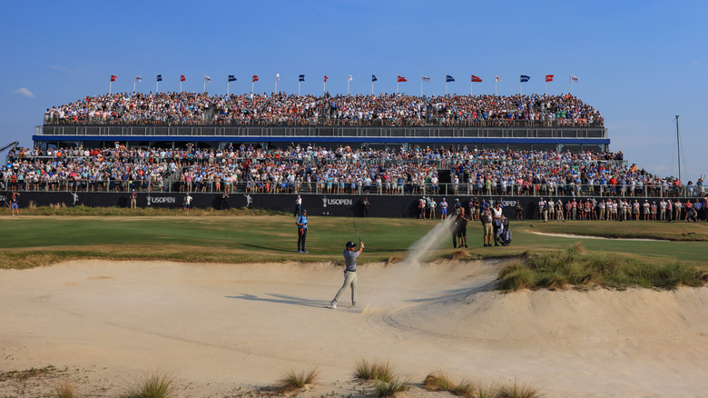 Bryson DeChambeau plays his third shot on the 18th hole during the final round of the 2024 U.S. Open Championship on the No.2 Course at The Pinehurst Resort on June 16, 2024 in Pinehurst, North Carolina.