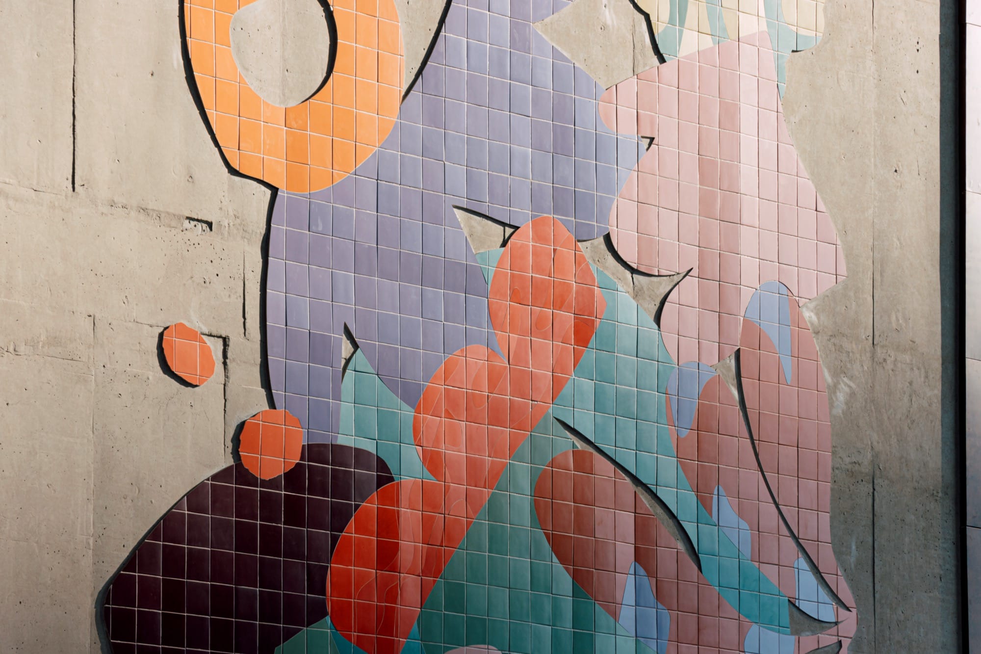 a mural by Alex Proba of colorful ceramic tiles in the shape of plants