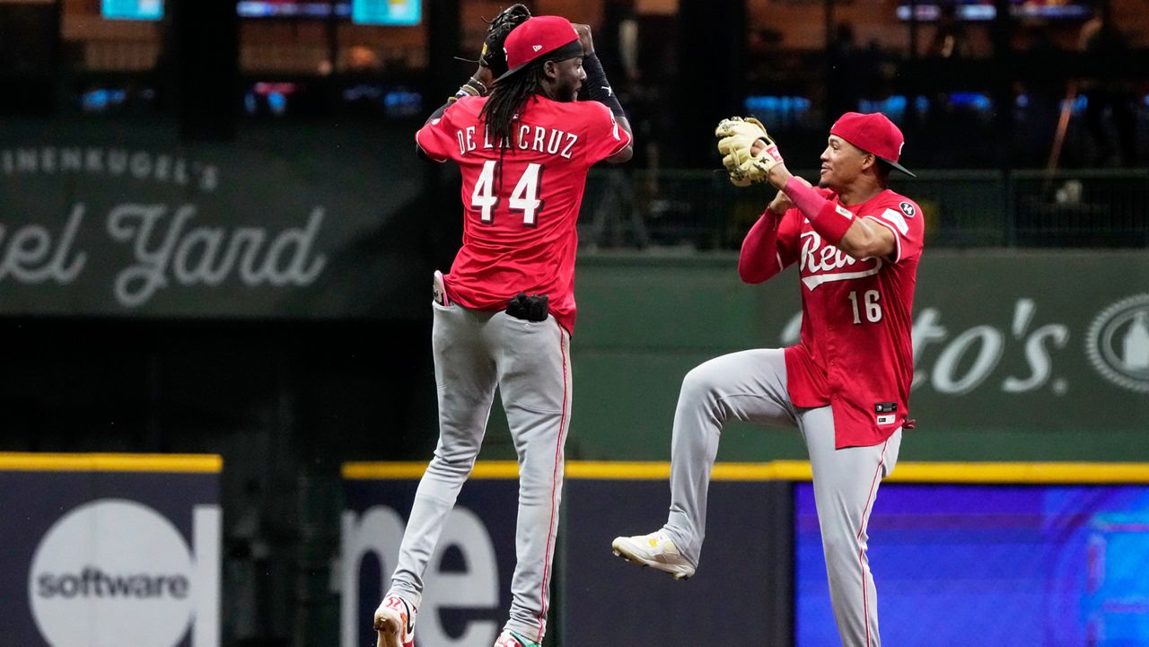 Cincinnati Reds' Elly De La Cruz and Noelvi Marte celebrate after a baseball game against the Milwaukee Brewers Friday, Sept. 26, 2025, in Milwaukee.