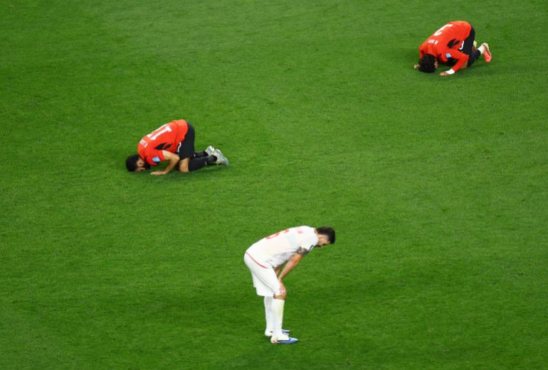 Soccer Football - FIFA World Cup 2026 - Group G - Egypt v Iran - Seattle Stadium, Seattle, Washington, U.S. - June 26, 2026 Egypt's Mohanad Lashin and Egypt's Mohamed Hany celebrate as Iran's Saeid Ezatolahi looks dejected after the match REUTERS/Lisi Niesner