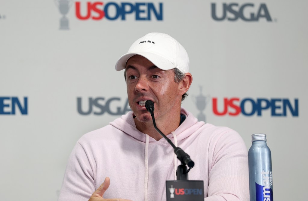 Rory McIlroy speaking at a press conference with "US OPEN" and "USGA" logos in the background.