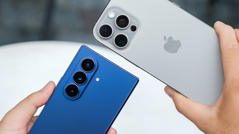 Samsung Galaxy smartphone next to an Apple iPhone