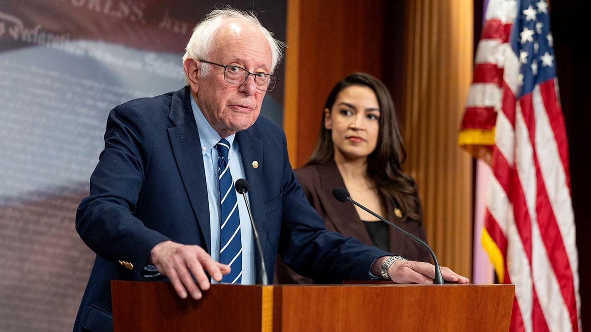 Sen. Bernie Sanders and Rep. Alexandria Ocasio-Cortez holding a press conference at the US Capitol