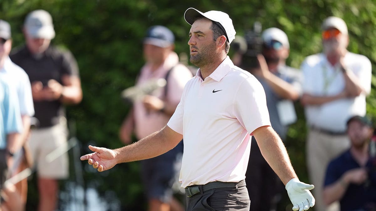 Scottie Scheffler reacting to his tee shot on the 16th hole at Muirfield Village Golf Club