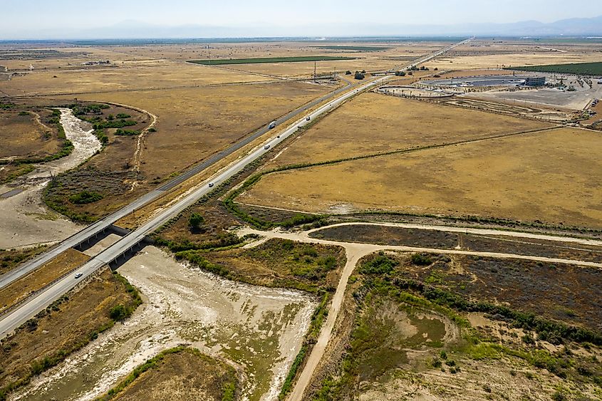 The dry, sandy bed of the Kern River in Bakersfield, California