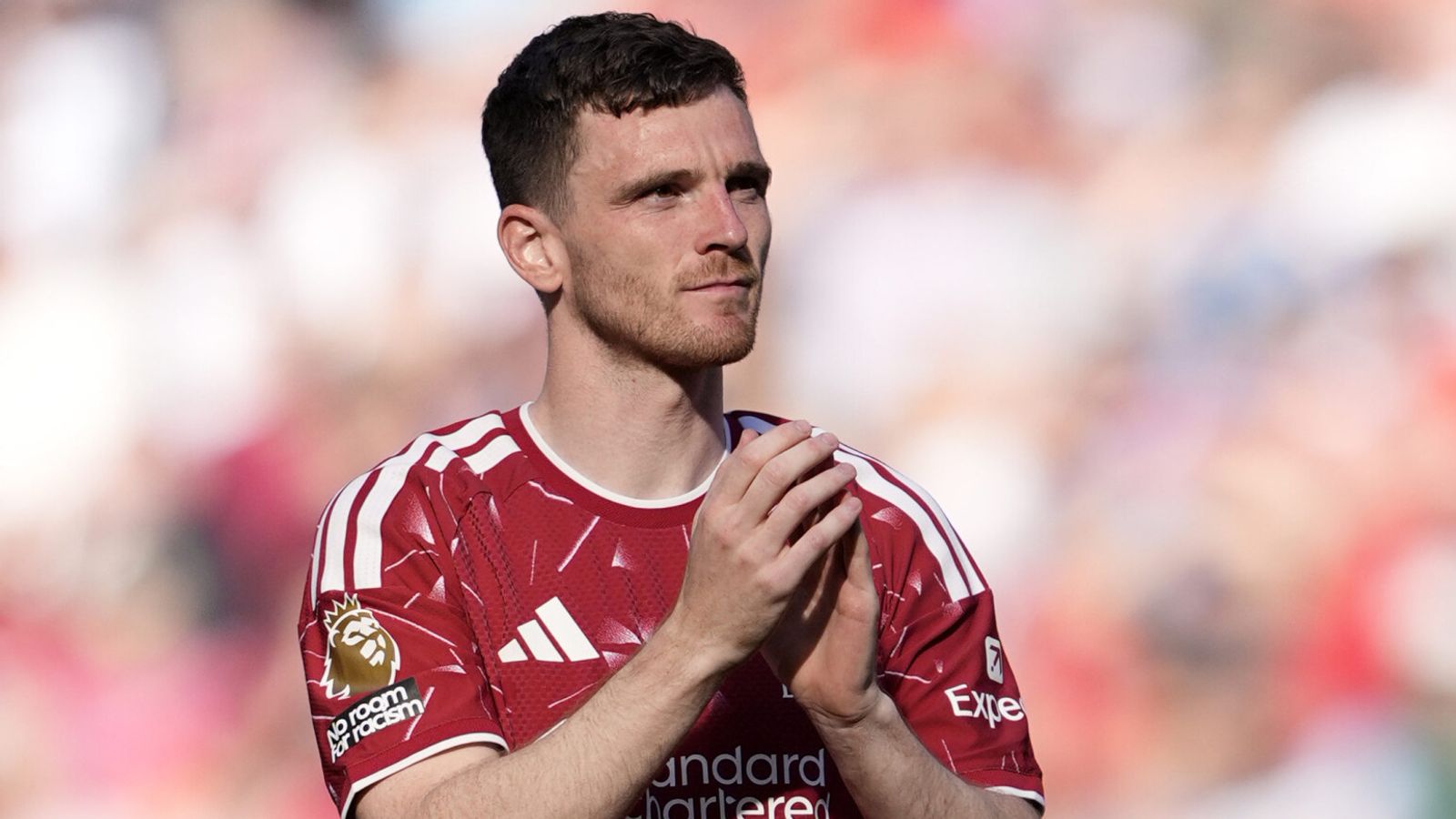 Andy Robertson applauds the fans at Anfield after his final Liverpool appearance