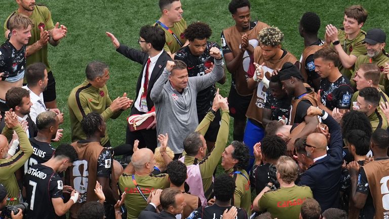 Canada head coach Jesse Marsch, center, celebrates after beating South Africa