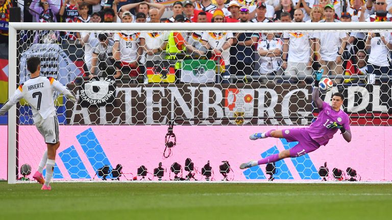 Paraguay goalkeeper Orlando Gill (12) blocks a shot by Germany's Kai Havertz (7) in a shootout during the World Cup r