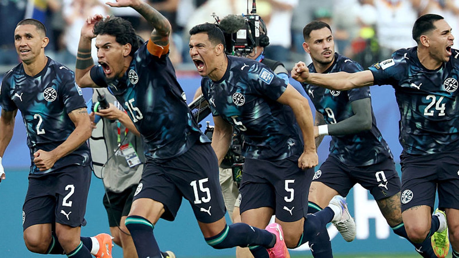 Paraguay's players celebrate after winning the penalty shootout during the 2026 World Cup round of 32 football match between Germany and Paraguay at the Boston Stadium in Foxborough on June 29, 2026.  (Photo by FRANCK FIFE / AFP)