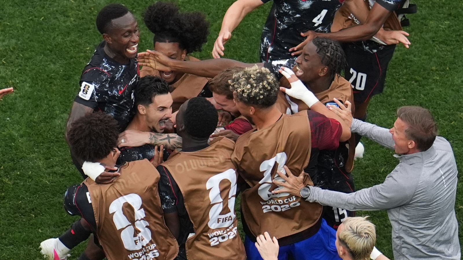 Canada's Stephen Eustaquio celebrates with team-mates after scoring his side's winner against South Africa. (AP Photo/Marcio Sanchez)