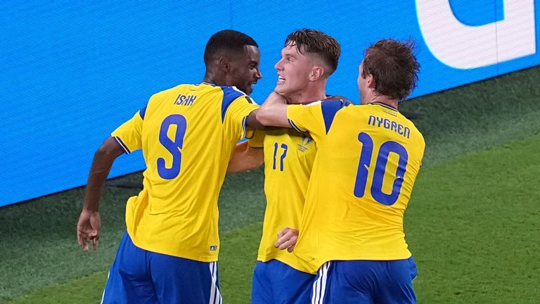 Sweden's Viktor Gyokeres (17) celebrates with Benjamin Nygren (10) and Alexander Isak (9) after scoring their third goal 