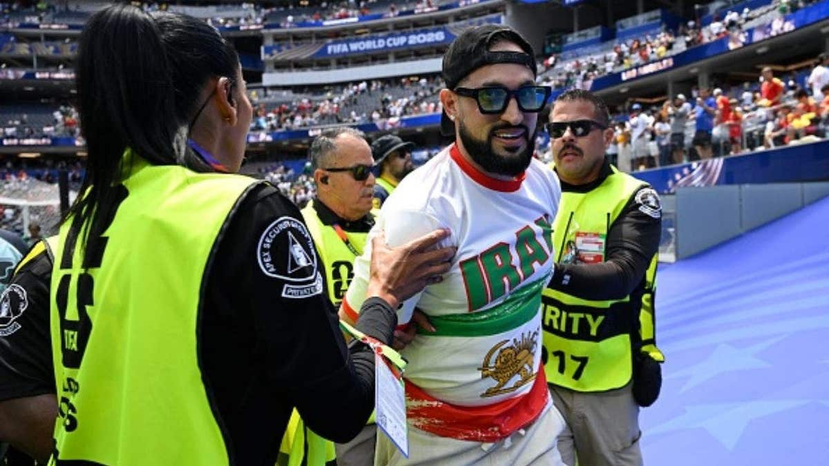 Iran supporter detained by security during Belgium-Iran FIFA World Cup 2026 Group G match at SoFi Stadium, Los Angeles. ( Photo by Nico Vereecken / Photo News via Getty Images)