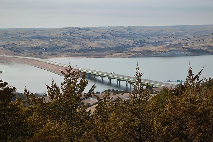 A truck crossing the Missouri River in South Dakota on a long bridge.
