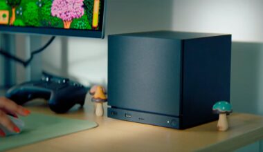 A Steam Machine sits on a desk.