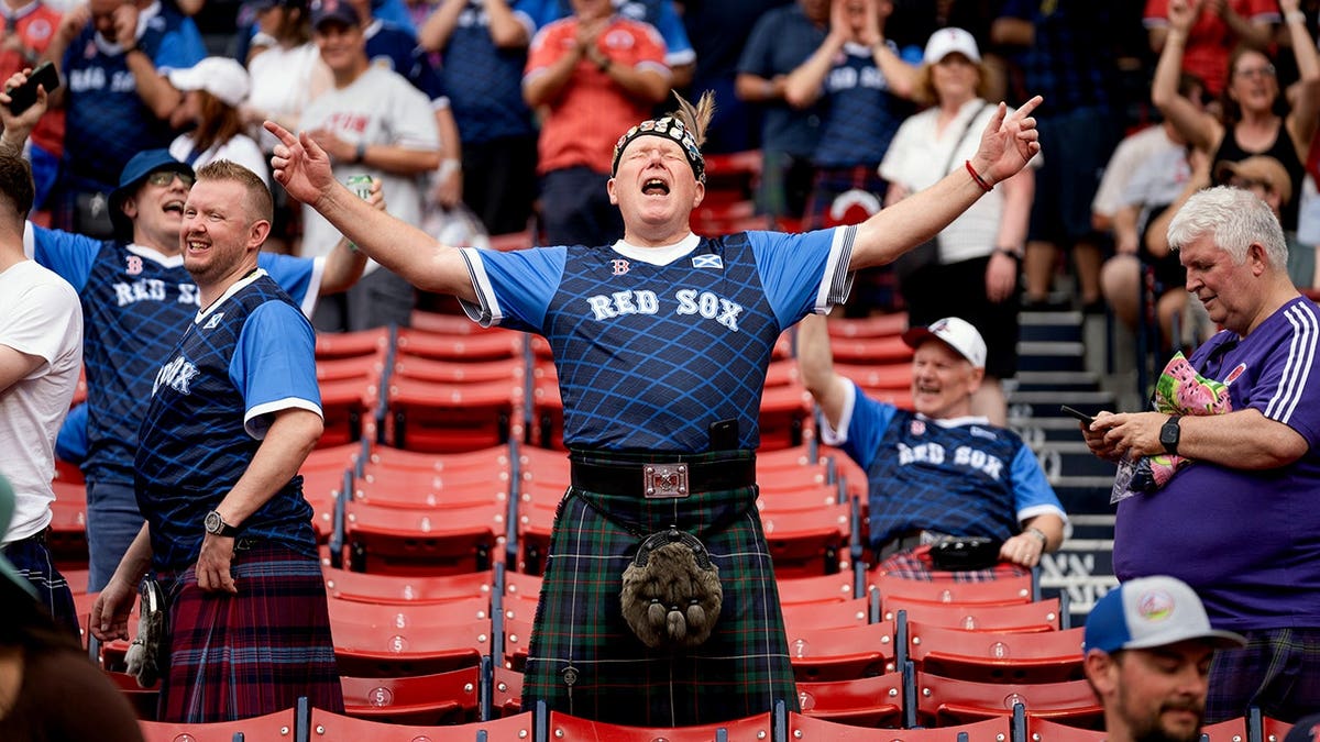 Members of the Tartan Army seated in the stands at Fenway Park.
