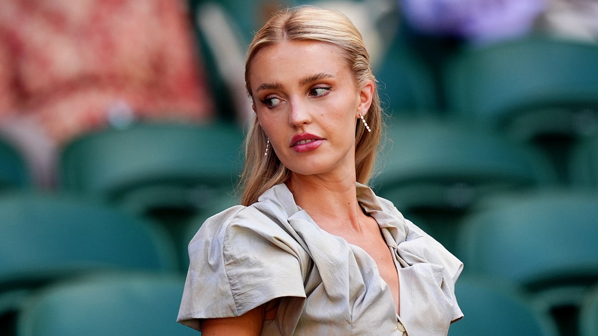 Morgan Riddle standing at the All England Lawn Tennis and Croquet Club in London