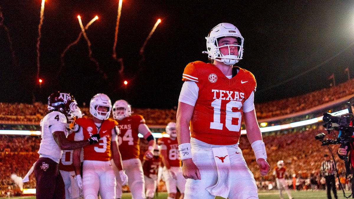 Texas quarterback Arch Manning celebrating a touchdown during a football game in Austin