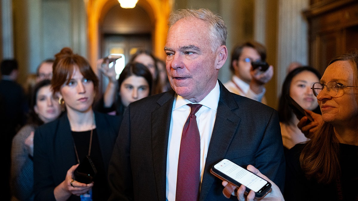 Sen. Tim Kaine speaking to reporters outside Senate Democrats caucus lunch meeting at U.S. Capitol