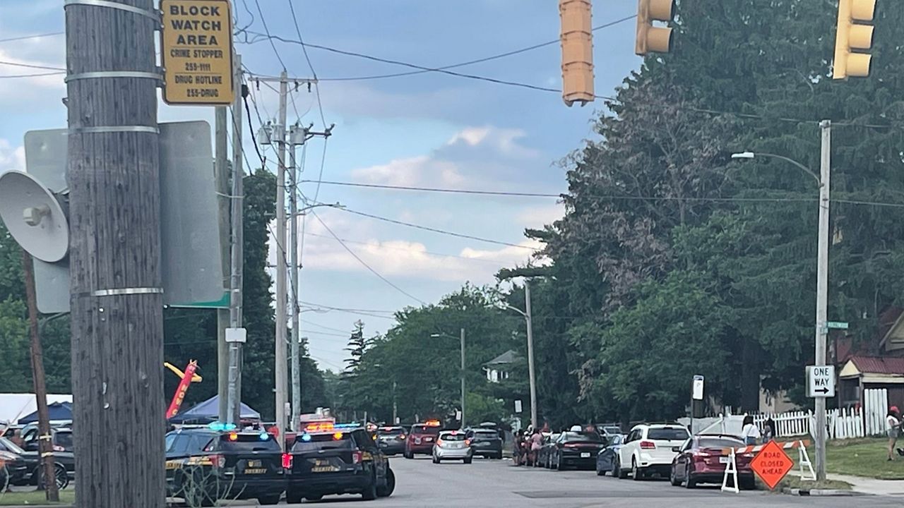 Police officers work at the scene of a shooting near a festival in Toledo, Ohio on Saturday, June 6, 2026. (WTVG via AP)