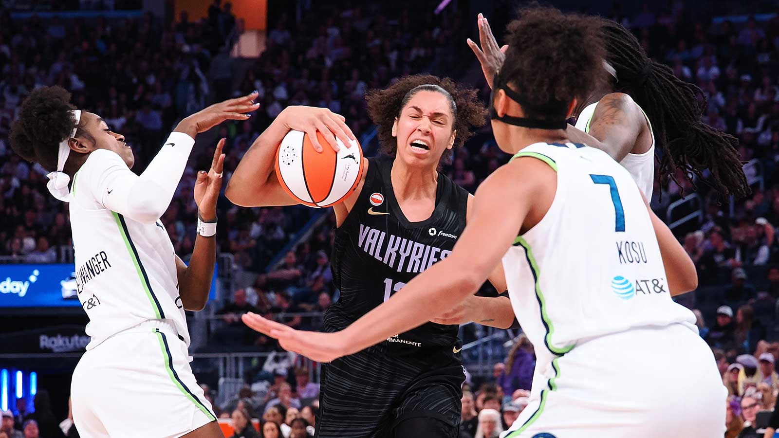 Golden State Valkyries forward Janelle Salaun (13) controls the ball against Minnesota Lynx defenders during the third quarter at Chase Center. 