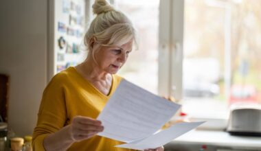 A person holding documents.