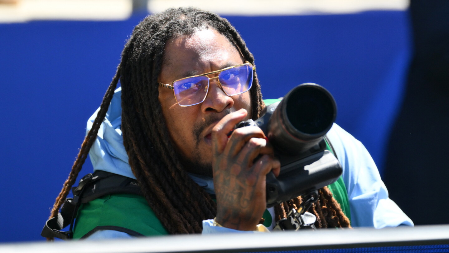 Marshawn Lynch is a credentialed photographer at World Cup