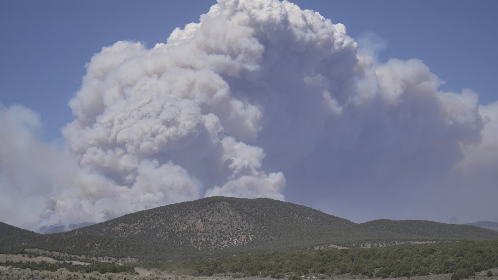 Dangerous weather hampers firefighters and leads to fireworks bans in western US