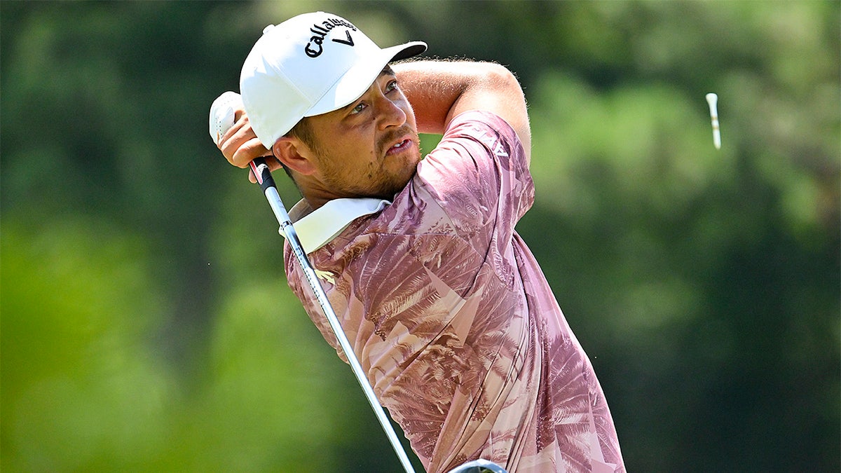Xander Schauffele playing a golf shot from the third tee at the FedEx St. Jude Championship in Memphis, Tennessee.