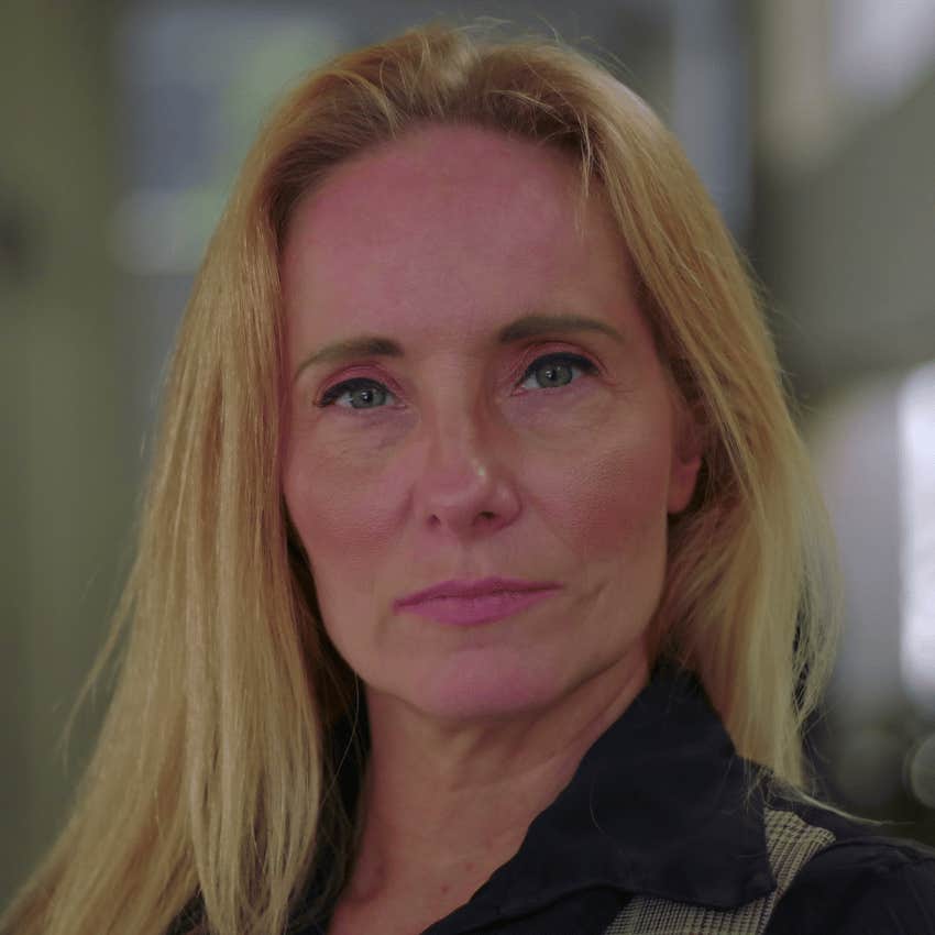 miserable woman observing group dynamics at work