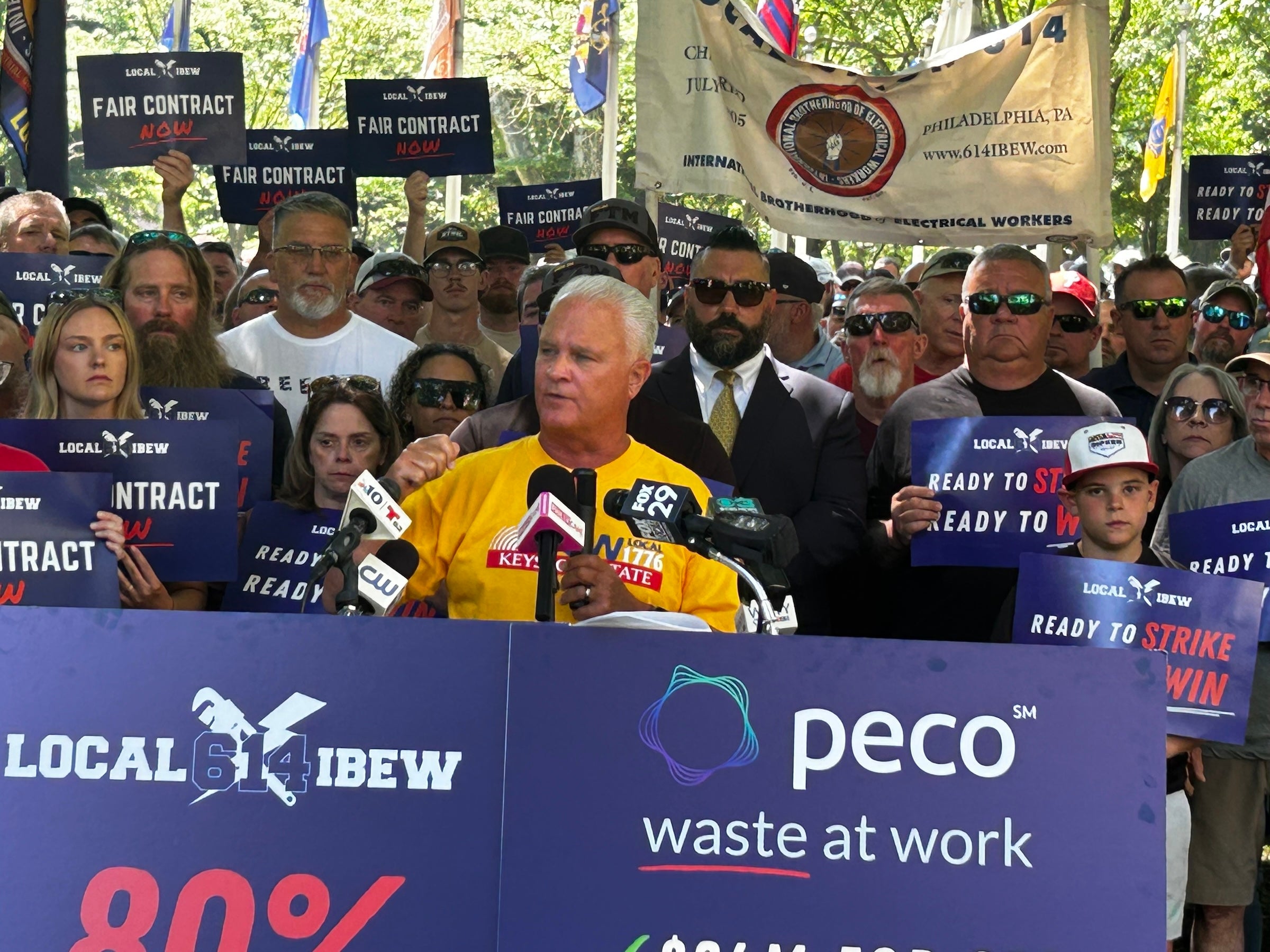 Wendell Young speaking at a podium in Washington Square Park on June 25, 2025