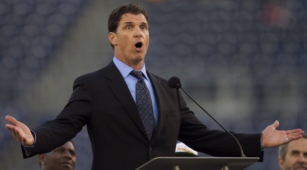 Former Chargers linebacker Billy Ray Smith speaks during the memorial service, recalling a memory of playing football alongside Junior Seau. (Scott Allison) 