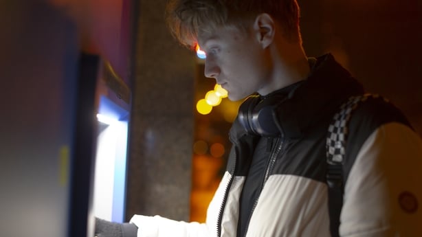 man using ATM