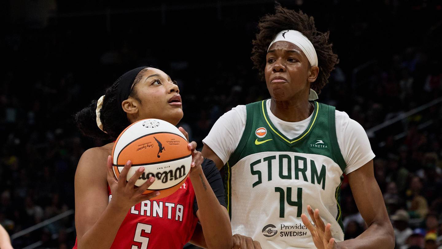Jun 27, 2026; Seattle, Washington, USA; Atlanta Dream forward Angel Reese (5) drives the ball to the basket in the first quarter against the Seattle Storm at Climate Pledge Arena. Mandatory Credit: Richard Dizon-Imagn Images