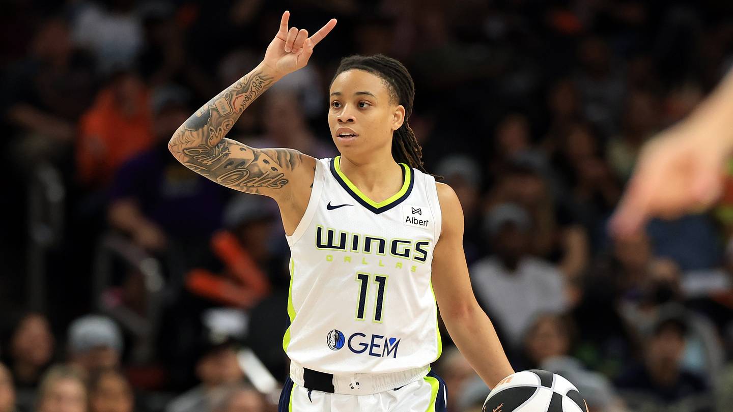 Jun 11, 2025; Phoenix, Arizona, USA; Dallas Wings guard JJ Quinerly (11) against the Phoenix Mercury at PHX Arena. Mandatory Credit: Mark J. Rebilas-Imagn Images