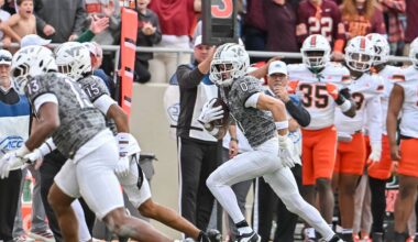 Nov 22, 2025; Blacksburg, Virginia, USA;  Virginia Tech Hokies tight end Ja'Ricous Hairston (13) and Virginia Tech Hokies wide receiver Shamarius Peterkin (15) block for Virginia Tech Hokies wide receiver Ayden Greene (0) as he runs after a catch against the Miami (FL) Hurricanes during the third quarter at Lane Stadium. Mandatory Credit: Brian Bishop-Imagn Images