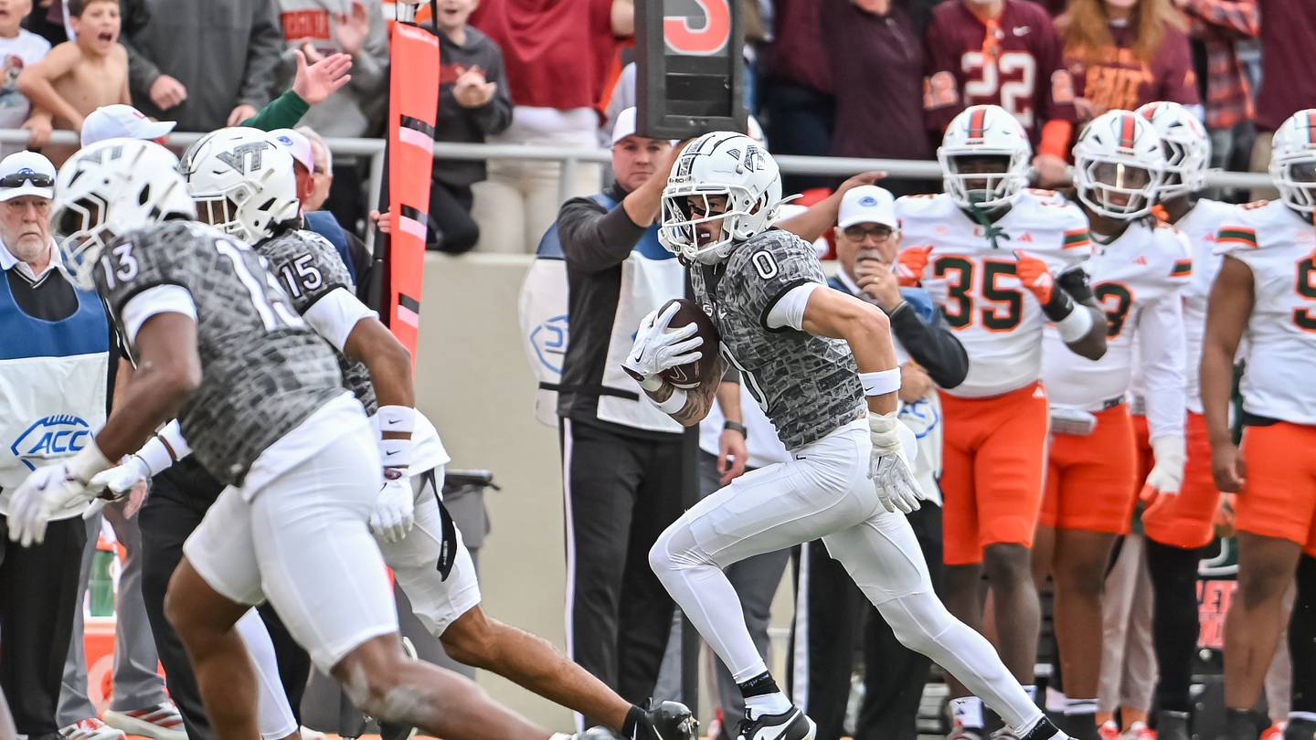 Nov 22, 2025; Blacksburg, Virginia, USA;  Virginia Tech Hokies tight end Ja'Ricous Hairston (13) and Virginia Tech Hokies wide receiver Shamarius Peterkin (15) block for Virginia Tech Hokies wide receiver Ayden Greene (0) as he runs after a catch against the Miami (FL) Hurricanes during the third quarter at Lane Stadium. Mandatory Credit: Brian Bishop-Imagn Images