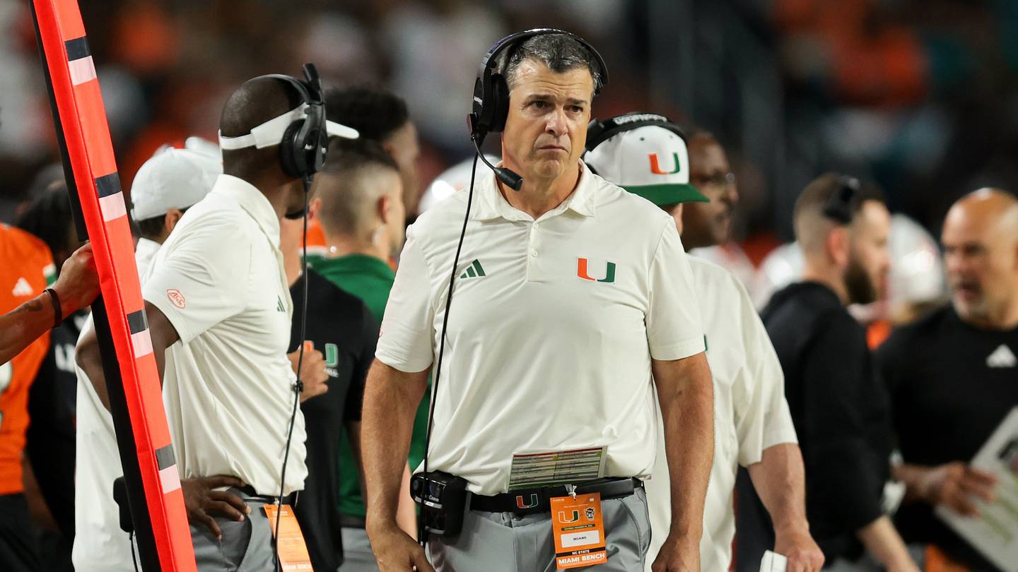 Nov 15, 2025; Miami Gardens, Florida, USA; Miami Hurricanes head coach Mario Cristobal watches from the sideline against NC State Wolfpack during the fourth quarter at Hard Rock Stadium. Mandatory Credit: Sam Navarro-Imagn Images