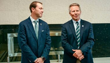 Michigan State University President Kevin Guskiewicz, right, as MSU Athletic Director J Batt looks on before the two’s panel discussion hosted by the Lansing Economic Club on Thursday, Sept. 11, 2025, at the Kellogg Center in East Lansing.