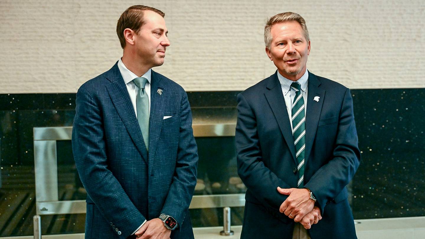 Michigan State University President Kevin Guskiewicz, right, as MSU Athletic Director J Batt looks on before the two’s panel discussion hosted by the Lansing Economic Club on Thursday, Sept. 11, 2025, at the Kellogg Center in East Lansing.