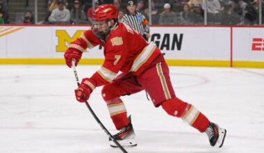 Apr 13, 2024; Saint Paul, Minnesota, USA; Denver Pioneers forward Aidan Thompson (7) makes a pass against the Boston College Eagles during the first period of the championship game of the 2024 Frozen Four college ice hockey tournament at Xcel Energy Center. Mandatory Credit: Nick Wosika-USA TODAY Sports