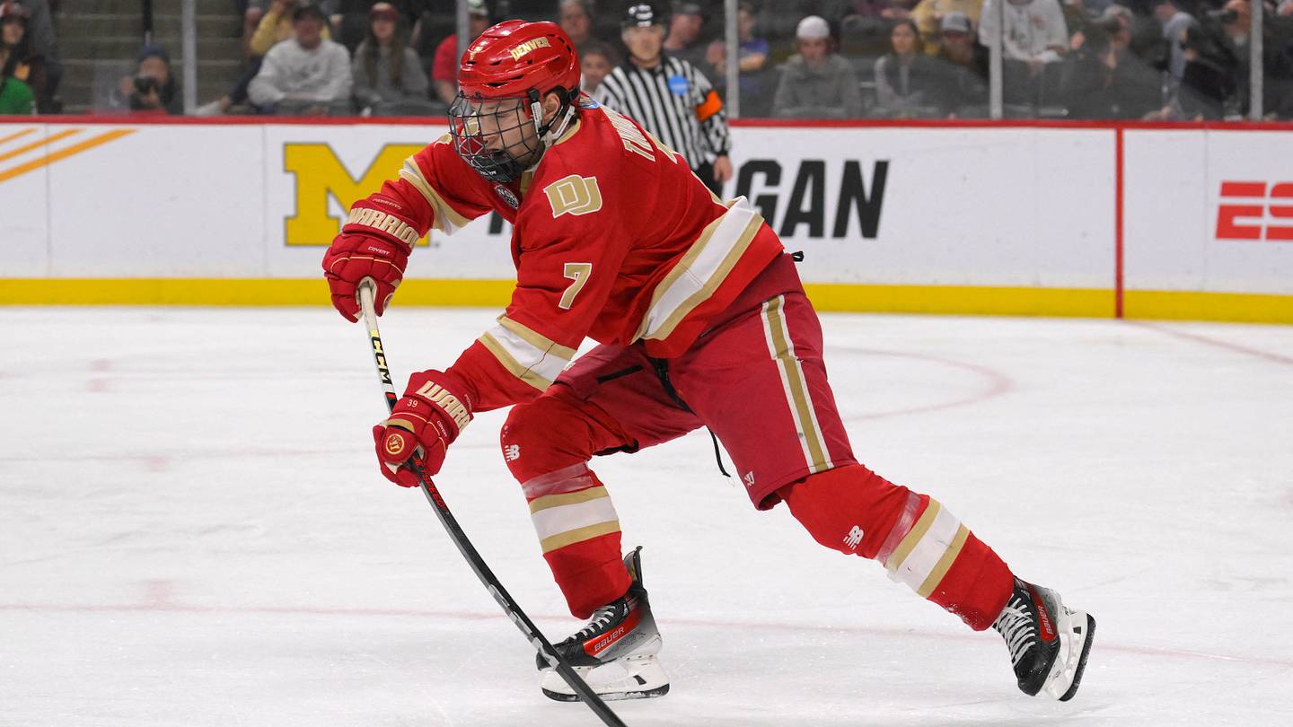 Apr 13, 2024; Saint Paul, Minnesota, USA; Denver Pioneers forward Aidan Thompson (7) makes a pass against the Boston College Eagles during the first period of the championship game of the 2024 Frozen Four college ice hockey tournament at Xcel Energy Center. Mandatory Credit: Nick Wosika-USA TODAY Sports