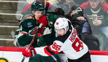 New Jersey Devils center Jack Hughes (86) hits Minnesota Wild center Joel Eriksson Ek (14): Brace Hemmelgarn-USA TODAY Sports